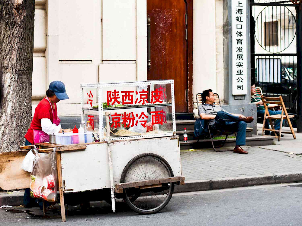 Many locals still choose small but long-standing eateries on the streets of Shanghai because of their authentic flavors 