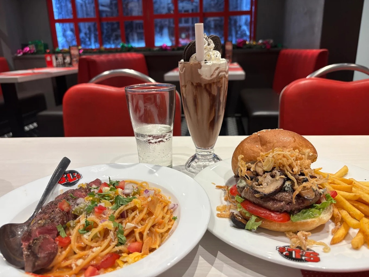 Hamburger at S&L's Diner with soft bun, delicious and juicy beef, fresh vegetables and cheese