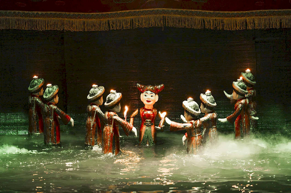 The Thang Long Water Puppet Show entertains audiences with traditional stories performed on a water stage