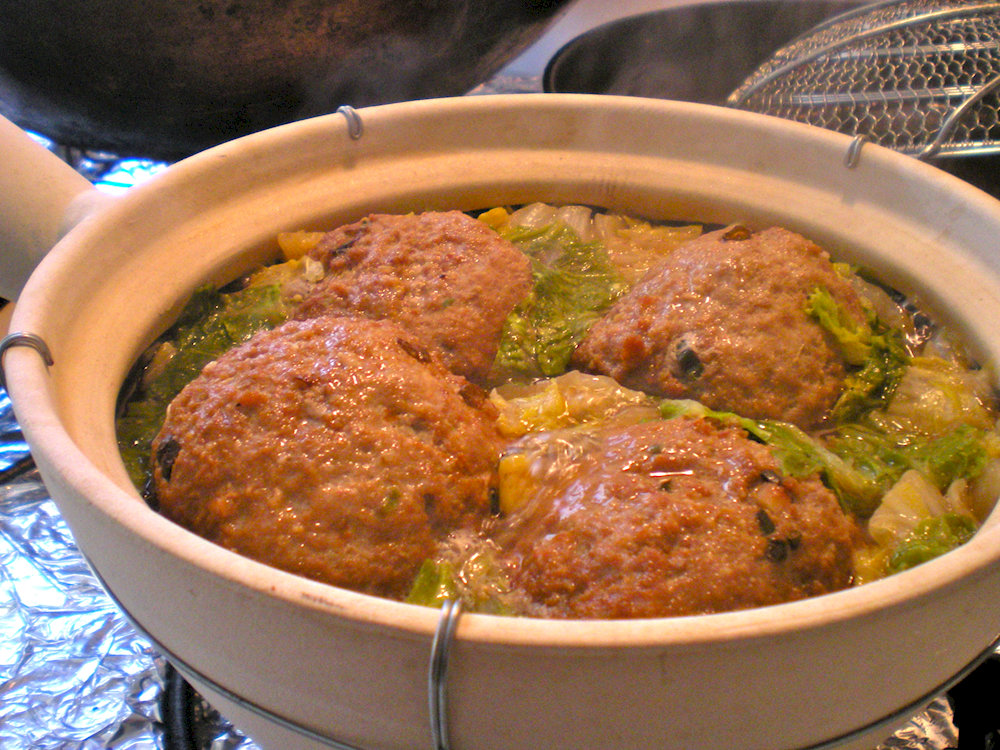 Shīzi Tóu is a dish with large meatballs cooked in a light broth