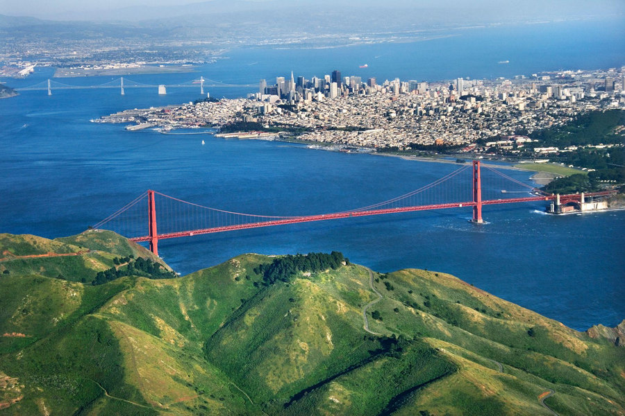 The Golden Gate Bridge spans elegantly over San Francisco Bay, showcasing stunning vistas and standing as an iconic feat of engineering brilliance