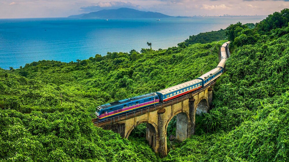Experiencing Hai Van Pass by train offers a safe and budget-friendly option, allowing travelers to admire the vast blue ocean and breathtaking natural scenery